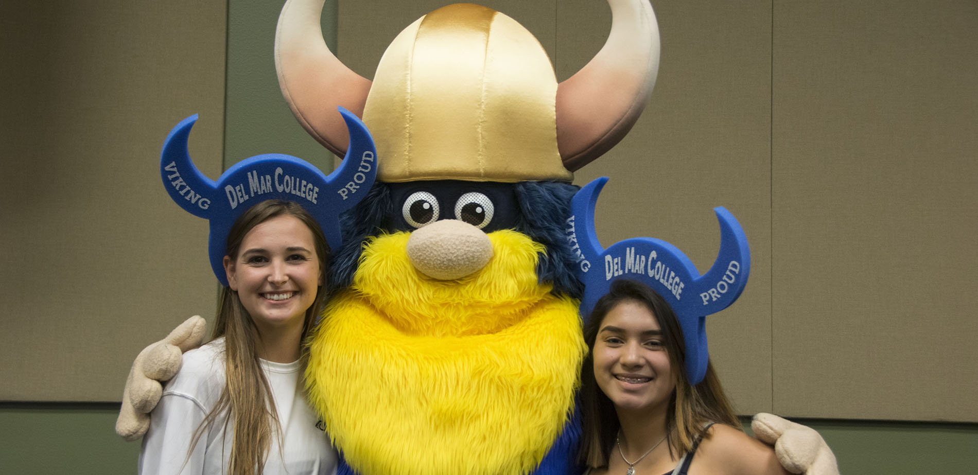 Prospective students at orientation with Valdar the Viking mascot