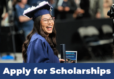 A female DMC graduate in cap and gown