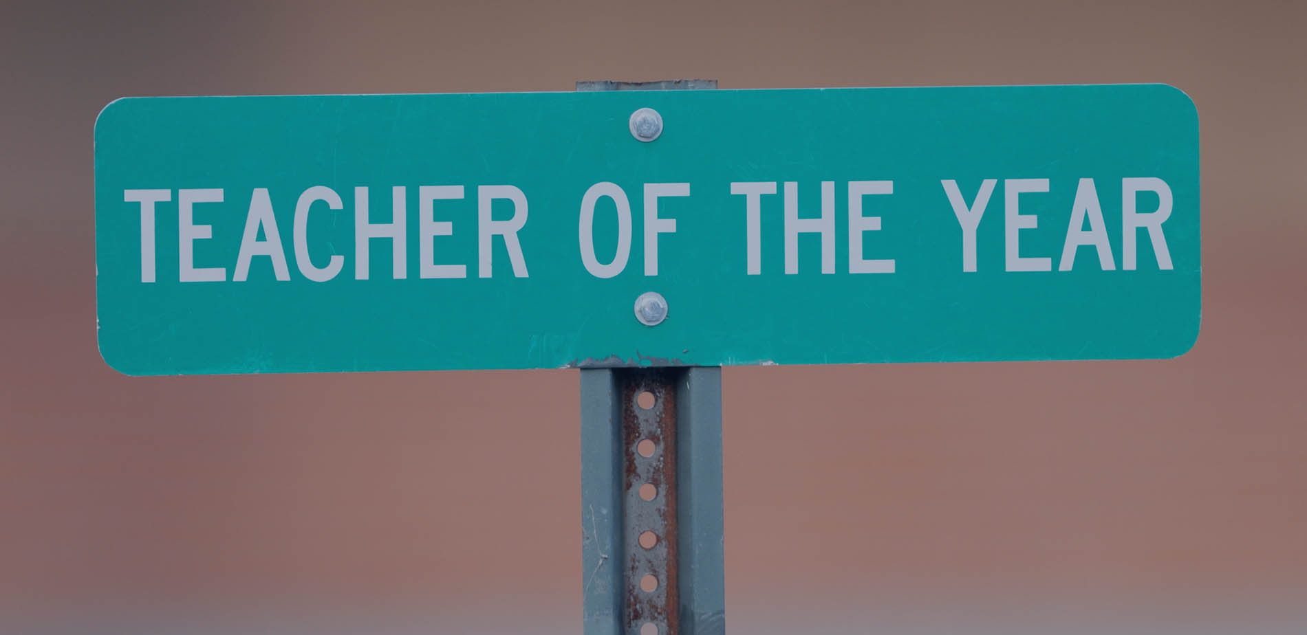 Road sign reading Teacher of the Year