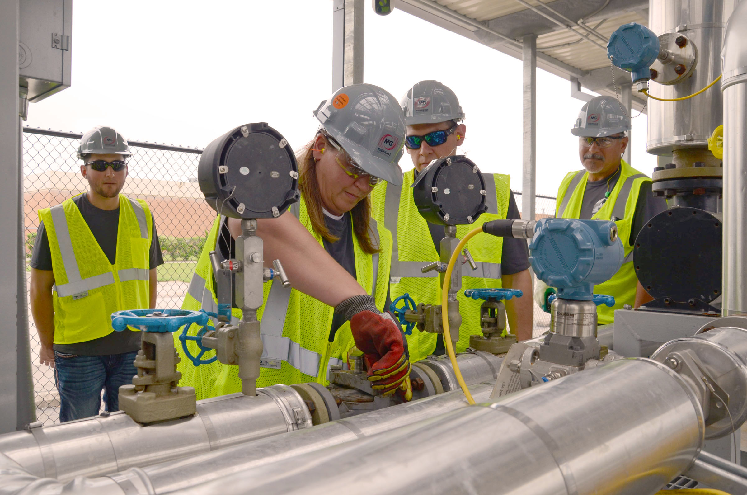 View of pipeline students working on a pipe.