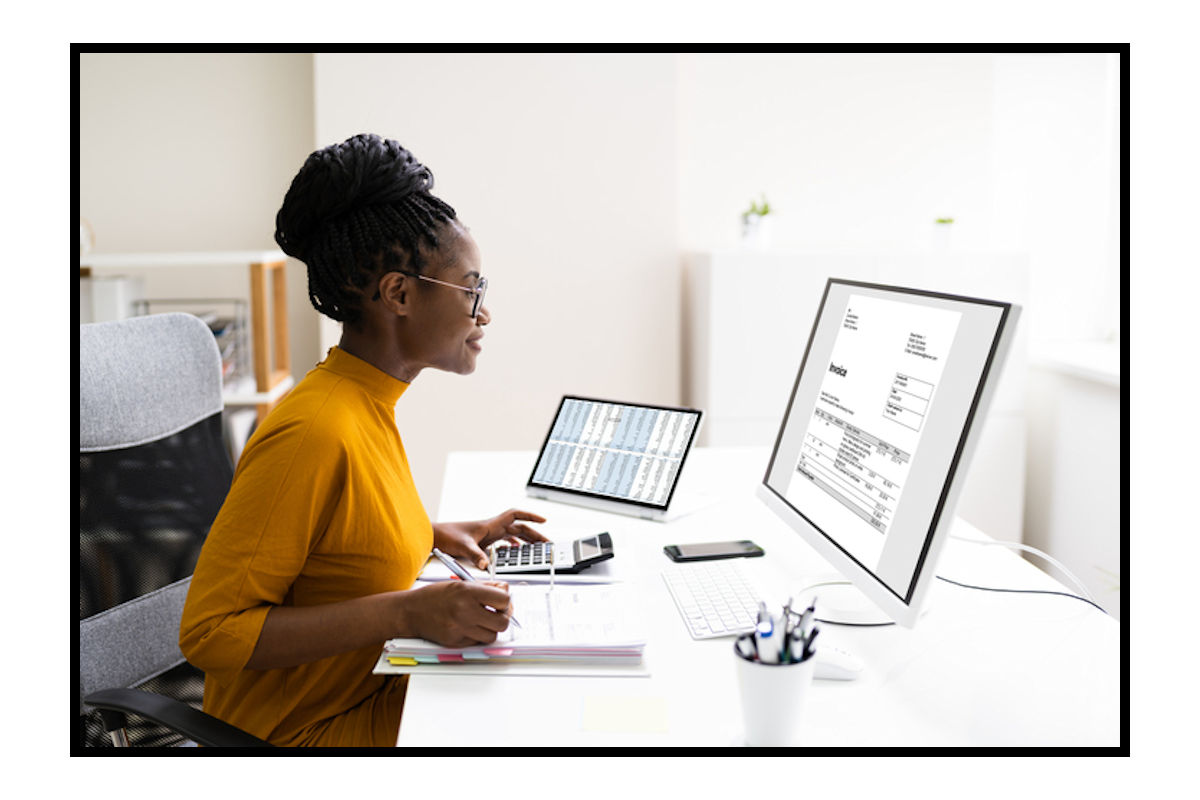 Woman looks at spreadsheets on the computer screen