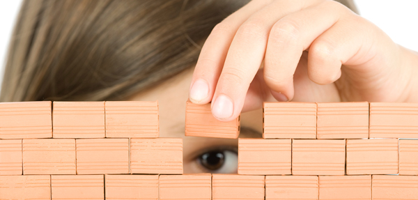 A child stacking up building blocks.