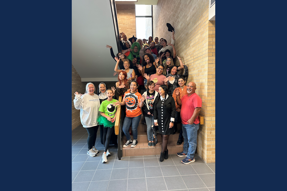 Event attendees pose for a group photo