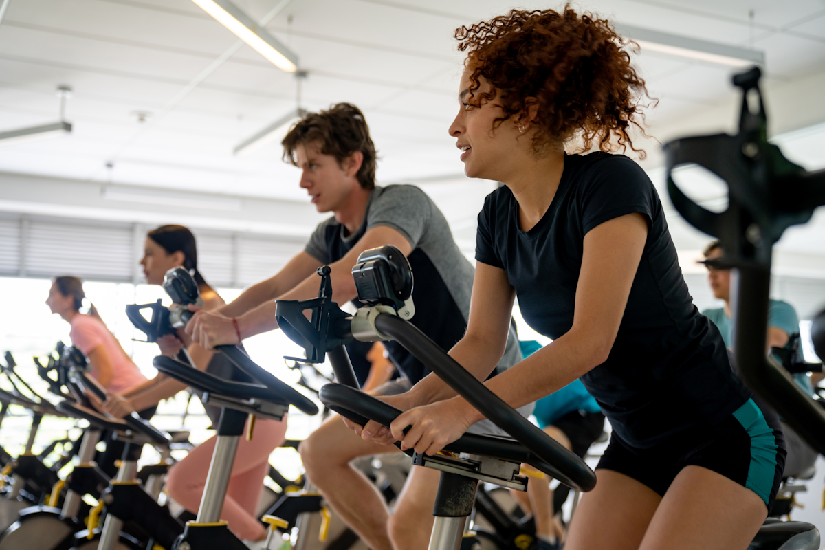 People in the gym in a bicycle spin class