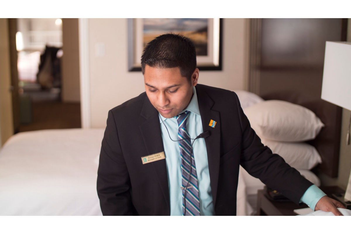 Male hospitality student interns at a hotel