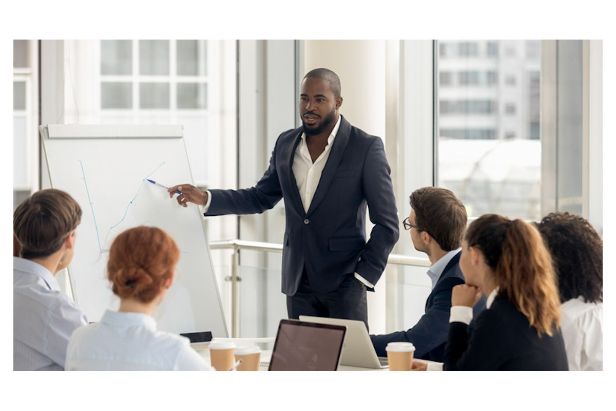 Business man leads management meeting