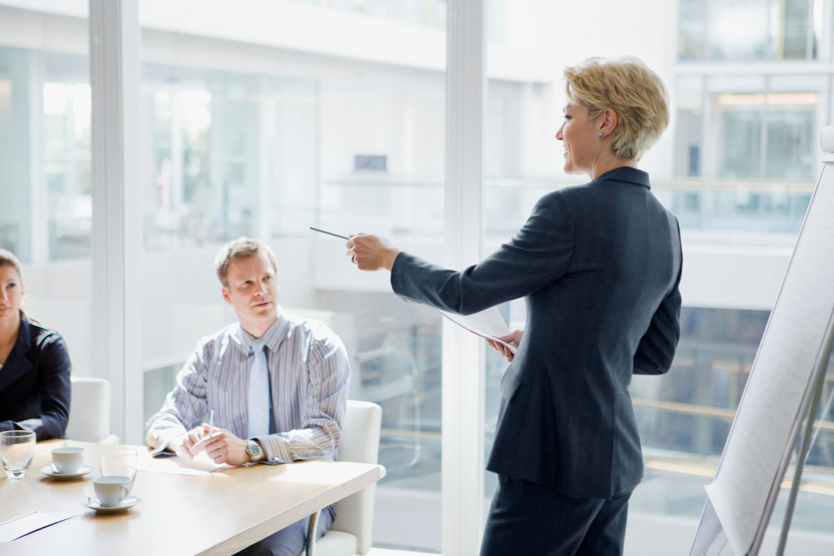 Business woman leads a management meeting