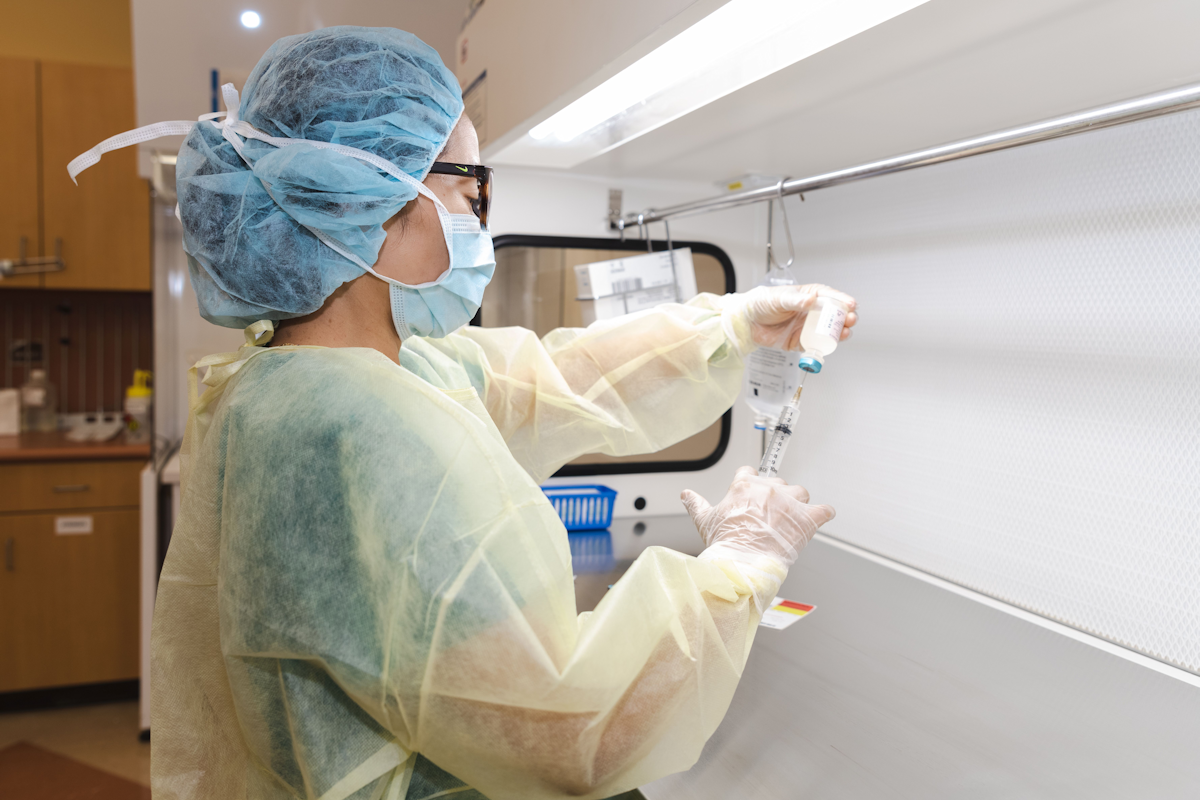 Pharmacy technician preparing an injection.