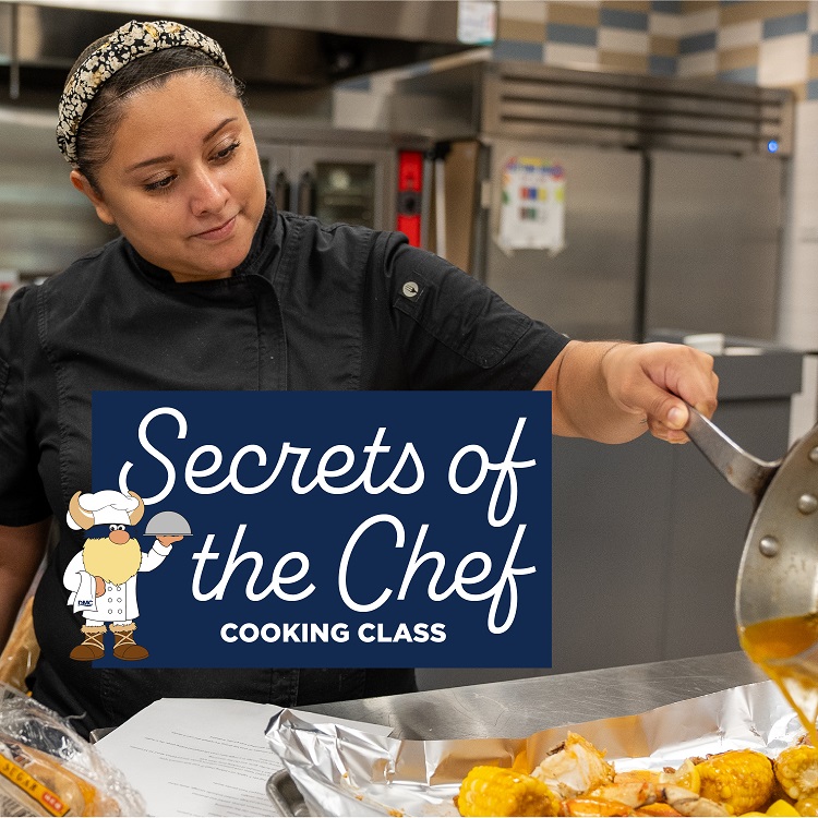 Chef pouring sauce.
