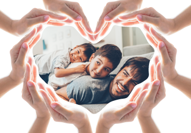 A heart shaped from caring hands around a father with his two sons