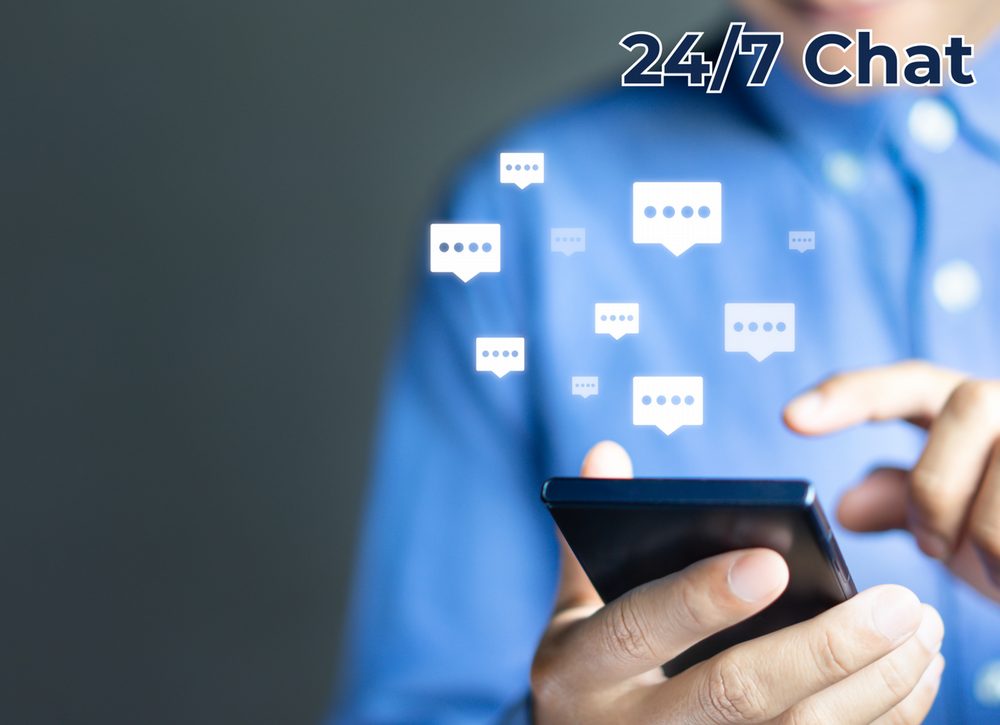 A man holding a cell phone and typing with the phrase 24/7 Chat on the image