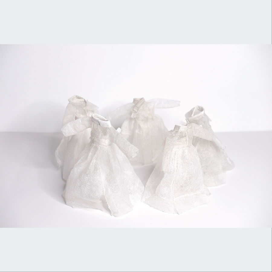 sculpture of dancers made out of dryer sheets