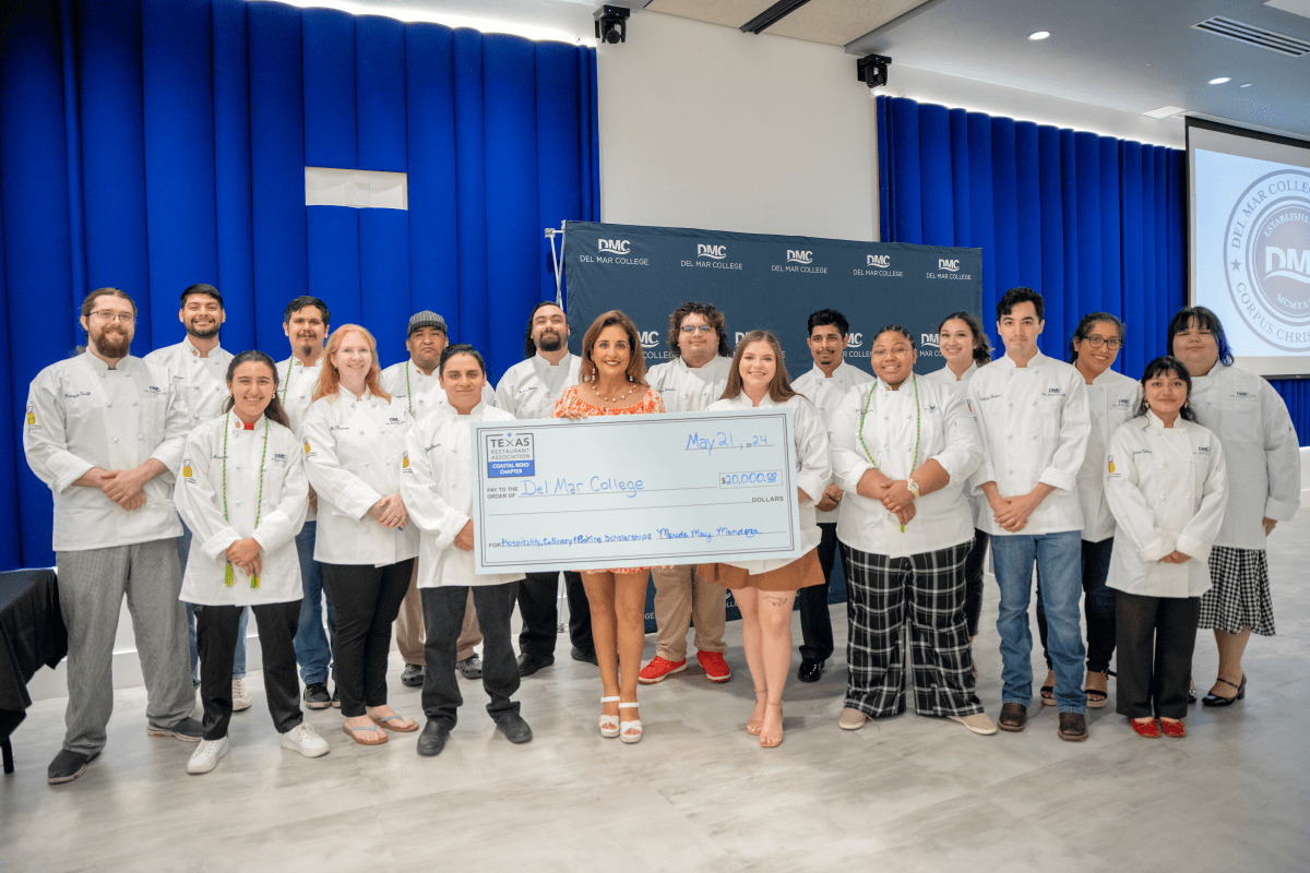 Culinary, Baking and Hospitality Management students posing for photo with scholarship donor