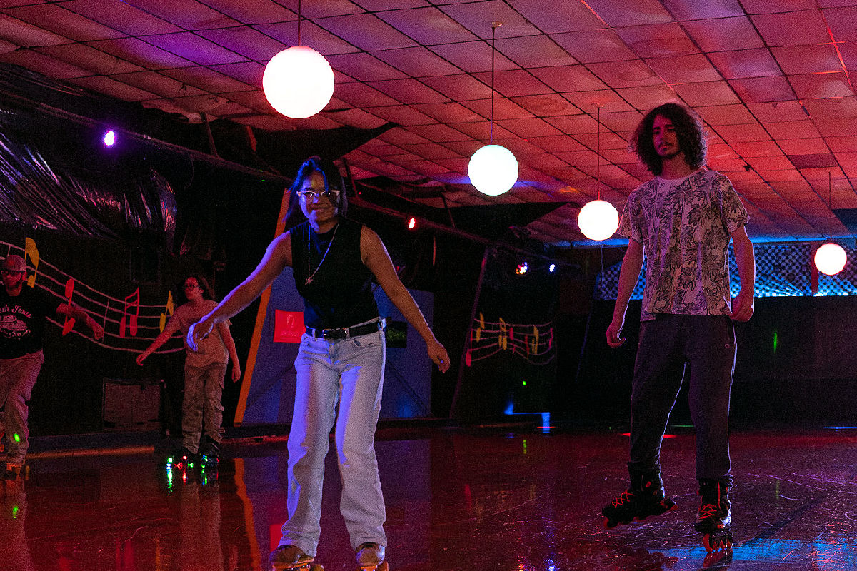 Several students skating at skating party