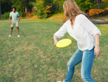 Man and woman playing frisbee