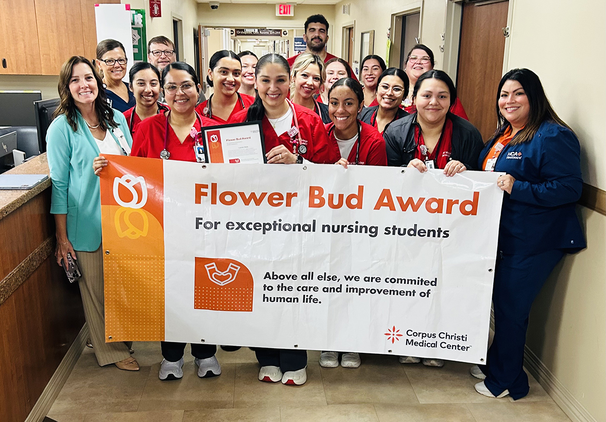 Lauren Mata surrounded by other nursing students and employees at nursing facility