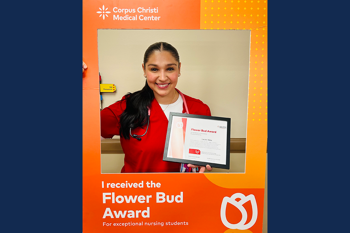 Lauren Mata holding her award.
