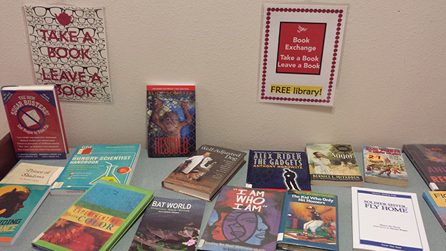 Books are displayed on a desk.