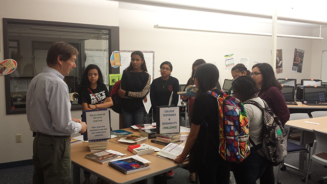 Students speaking to an instructor in the Reading Lab