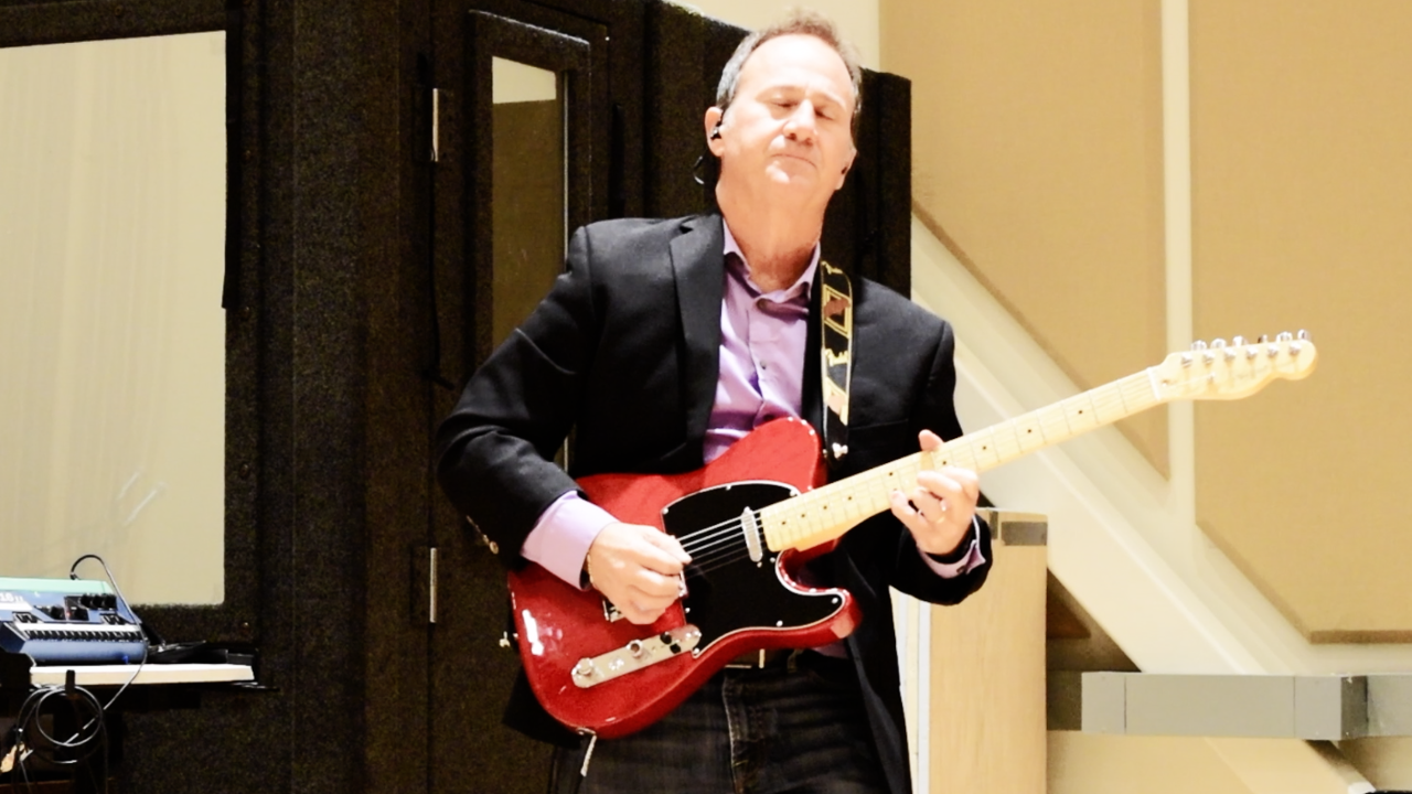 Paul Bissell plays guitar in session