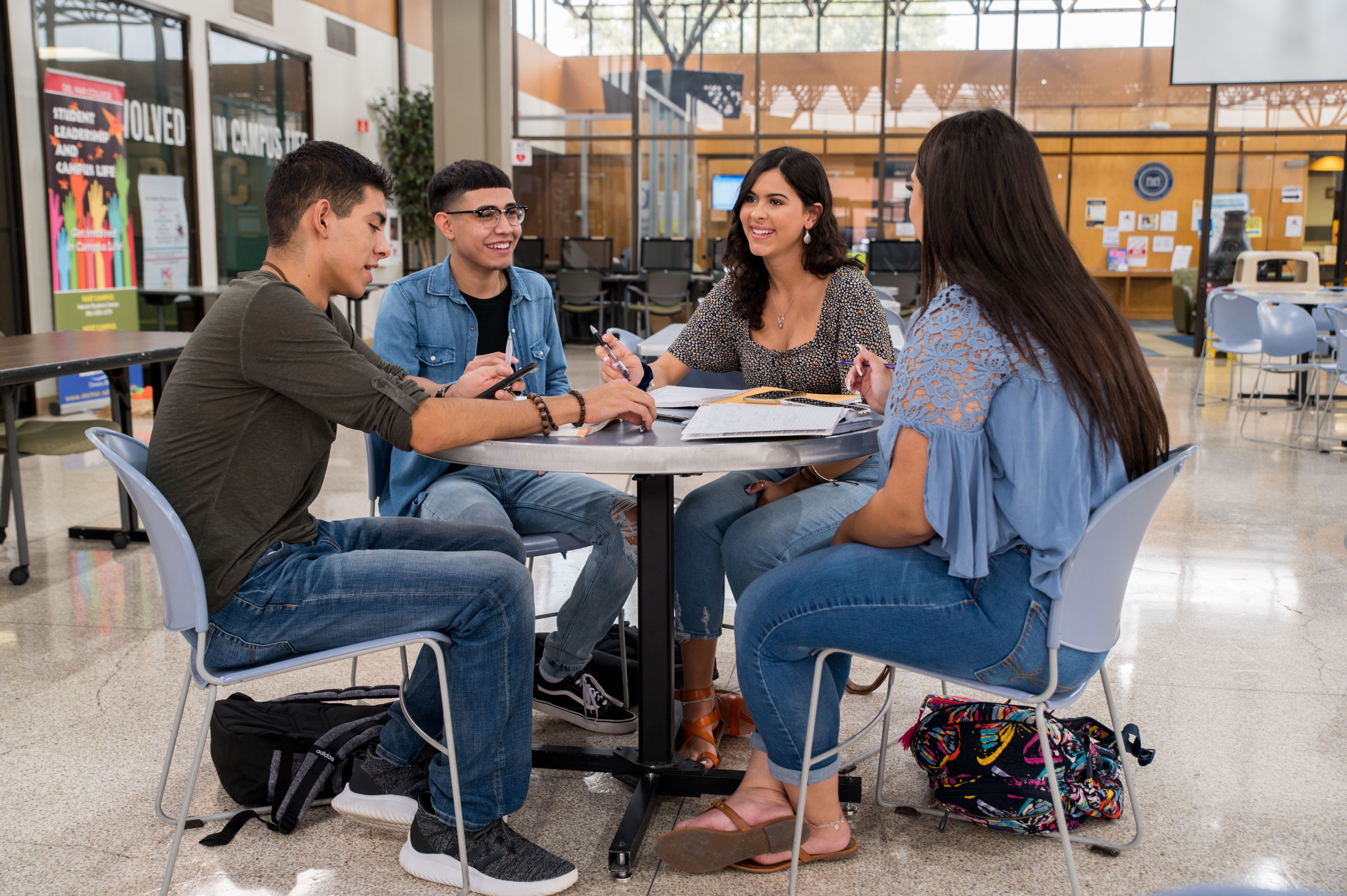 Four students studying around a table in the Coleman Center