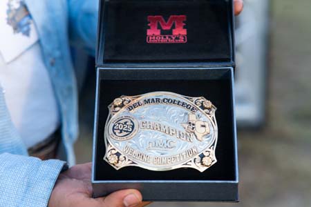 A giant custom belt buckle offered as a prize for the welding competition